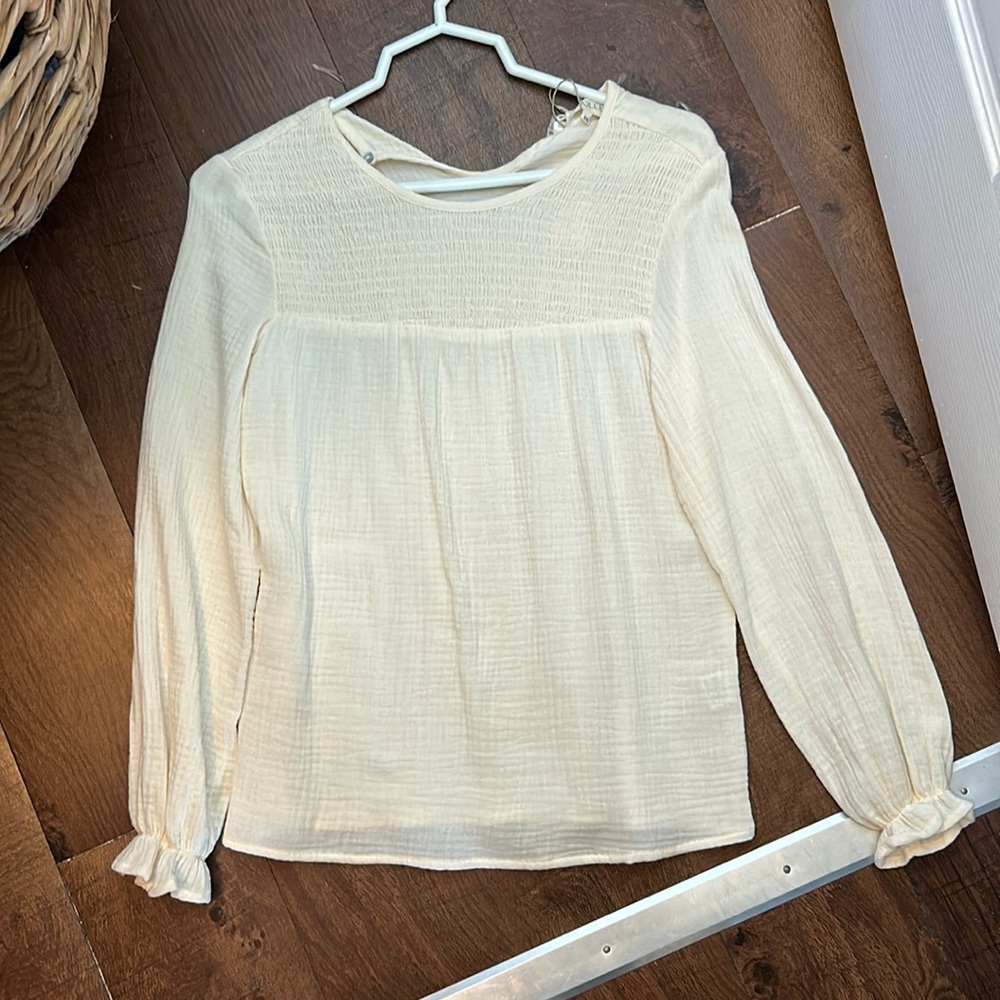 Cream color Roolee top with back button detail. Size xxs.